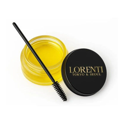 Yellow cosmetic product with a black applicator and Lorenti lid on a white background